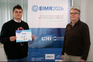 Thomas receiving his Best Poster award
