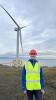 IDCORE Research Engineer - Jack Winfield standing in front of a wind turbine